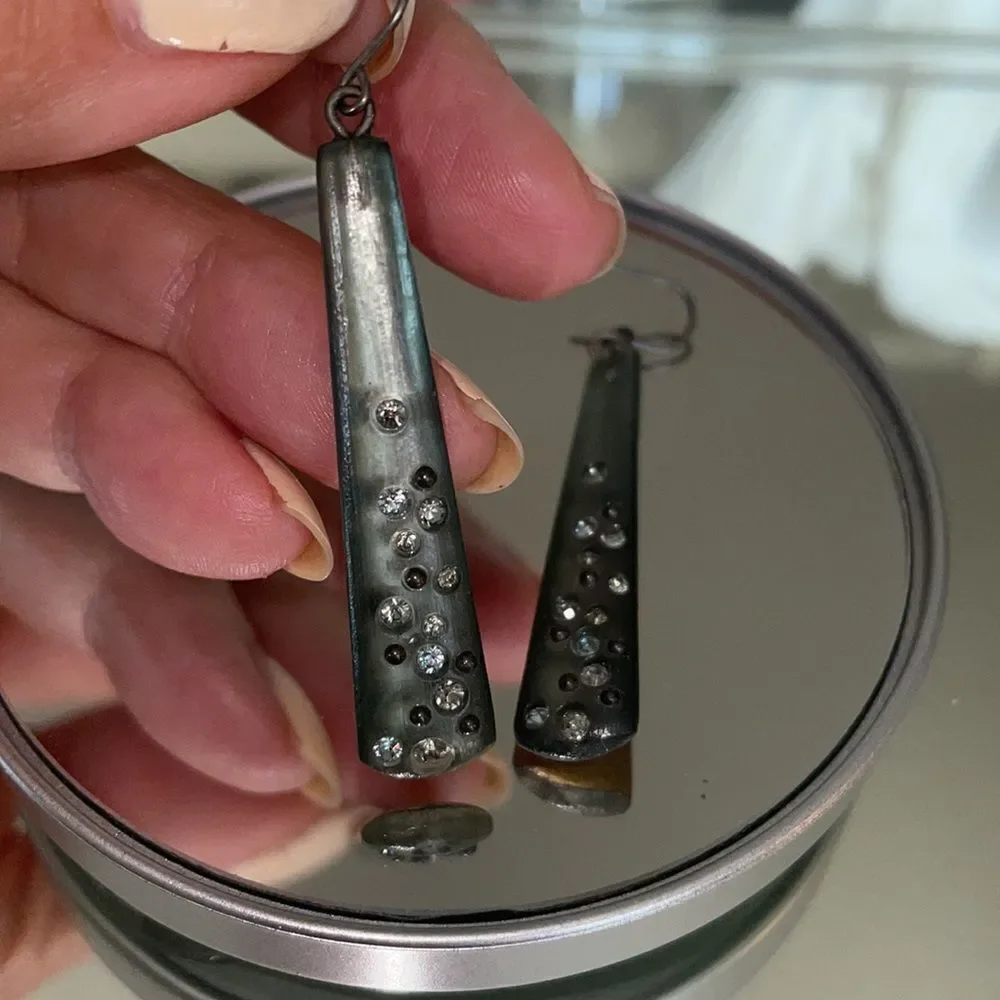 Shiny gray plastic dangle wire earrings embedded with‎ small rhinestones